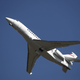 A photo of a private plane taking off.